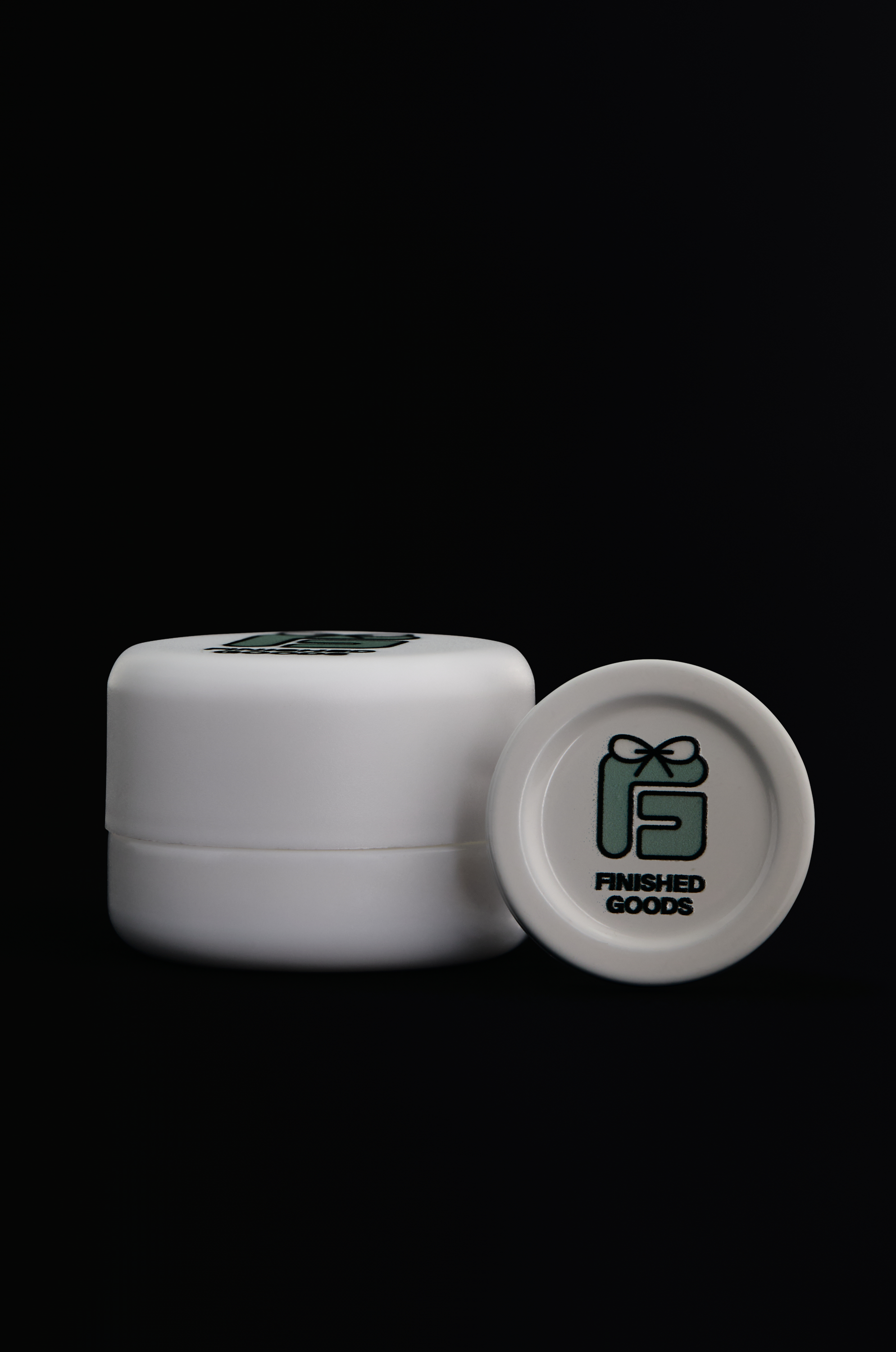 Two white concentrate jars with FG logo
